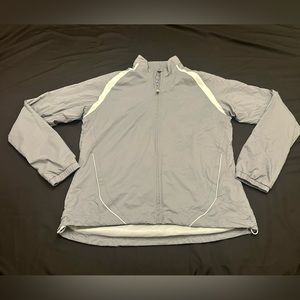 Under Armour golf wear women’s grey/white full zip jacket. Size small.